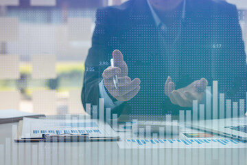 Business people working with finance graph in blurred office with double exposure of business infographics and graphs. Market analysis concept, data analysis technology.