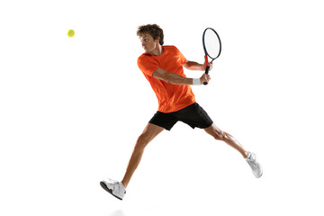 Young Caucasian man, tennis player training isolated on white background.