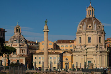 Fototapeta na wymiar Trajan Column, Santa Maria de Loreto church and Chiesa del Santissimo Nome di Maria in Trajan's Forum. Rome, Italy