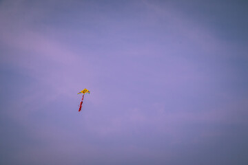 Colorful kite on Athenian sky, Greece