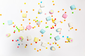Lots of marshmallows on a white background for a sweet tooth
