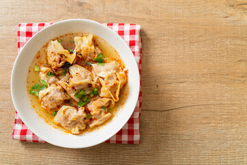 pork wonton soup or pork dumplings soup with roasted chili