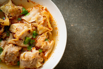 pork wonton soup or pork dumplings soup with roasted chili