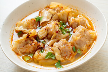 pork wonton soup or pork dumplings soup with roasted chili