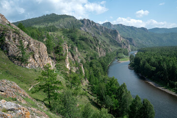 Fototapeta na wymiar Beautiful view of mountain river in summer, active tourism, hiking, ancestor trail, Khakassia ,Russia