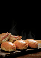 Mini bread and puff on black background.
