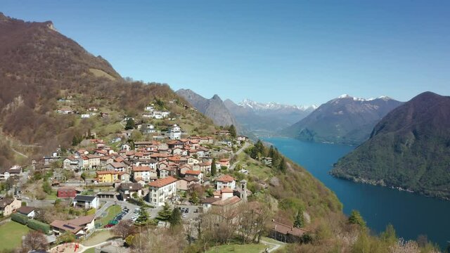 Aerial footage of Lugano lake and the Monte Brè village in Canton Ticino in southern Switzerland. Footage in spring day
