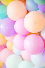 colorful balloons in pastel shades, festive background
