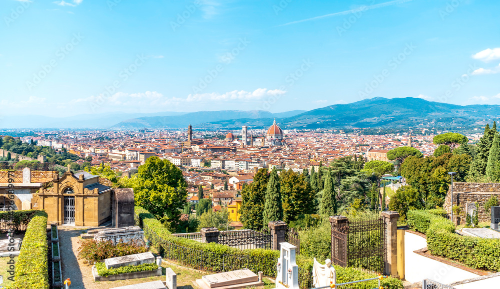 Wall mural Scenic view of Florence from the Basilica of San Miniato al Monte, near Piazzale Michelangelo. Blue sky and vegetation; Tuscany region, Italy.