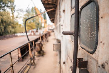 Steampunk. A hero on a river barge surrounded by steel mechanisms. A man with a weapon.