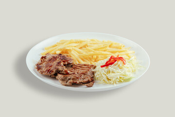 Pork with french fries and cabbage salad with bell peppers.