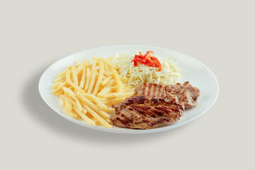 Pork with french fries and cabbage salad with bell peppers.