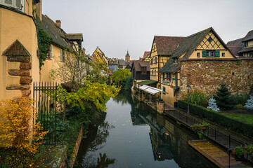 Fototapeta na wymiar A view on Lauch river in Colmar town in France on a autumn day
