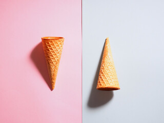 two waffle cups for ice cream on a colored background, minimalism style