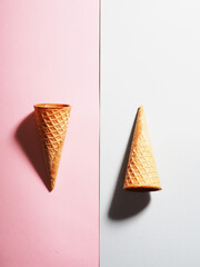 two waffle cups for ice cream on a colored background, minimalism style