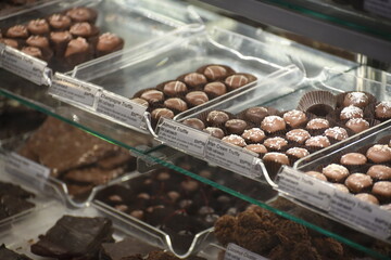 Chocolates and truffles for sale in a display case