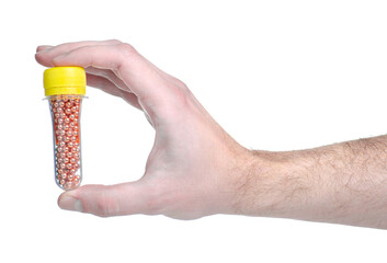 Bullet balls for airsoft in hand on white background isolation