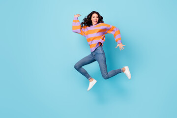 Fototapeta na wymiar Full length body size view of pretty crazy cheerful wavy-haired girl jumping fooling having fun isolated over bright blue color background