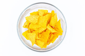 Top view Corn chips into a glass bowl, nachos isolated on white background