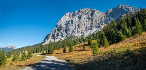 Fototapeta na wymiar hiking trail to Ehrwalder Almbahn upper station, famous Zugspitze mountain in the background