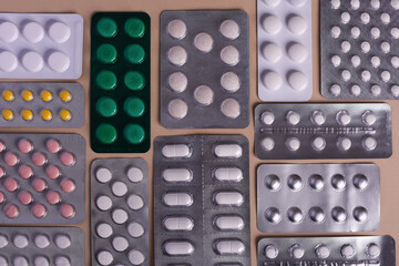 Pill tablets in a blister pack. Lots of flu medications. Background of pill packs.