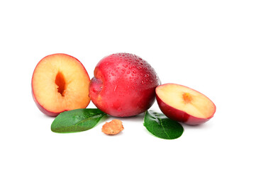 One whole plum and plum cut in half. The bone is visible in the foreground