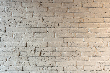 Texture of old white brick wall large with decorations and copy space Background