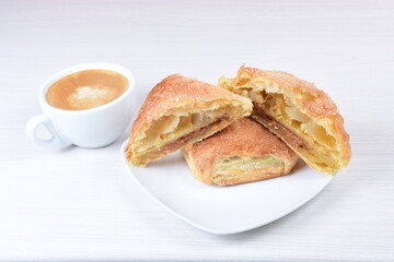 Arequipe puff pastry, on white wooden background