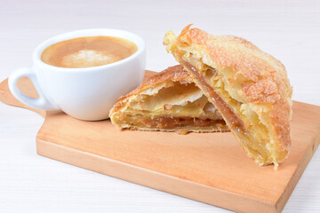 Arequipe puff pastry, on white wooden background