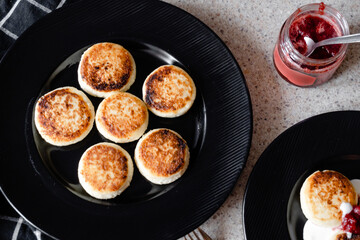 cheesecakes with strawberry jam on a plate