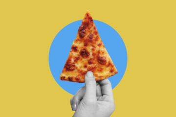 Hand holding slice of cheese pizza, on yellow background