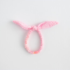 Creative Easter egg made of colorful hair bands on a white background. Minimal Easter or holiday concept. Flat lay.