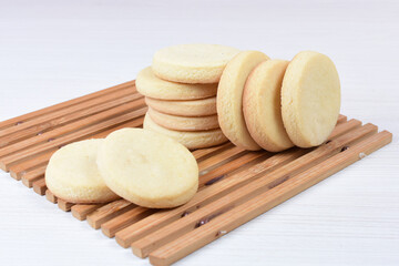 Butter cookies, on white wooden background