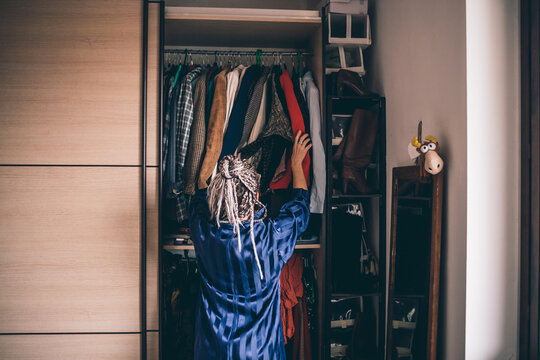 Adult woman choosing outfit gardrobe