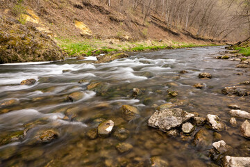 Obraz premium Whitewater River In The Woods During Spring