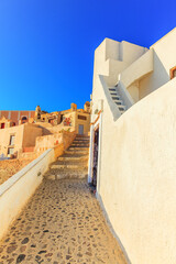 Greece Santorini island in Cyclades, traditional sights of colorful and white washed walk paths like narrow streets