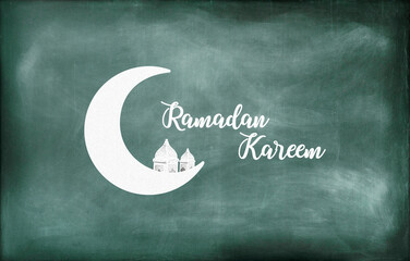 Crescent moon, Arabic lantern along with the text ramadan kareem written on a green board. Ramadan kareem concept.