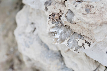 Mineral inside of stone. Unpolished quartz excavating or deposit. Semi-precious gems mining