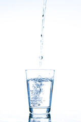 Pour water into a glass