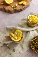 green tea with lemon and ginger on a wooden background