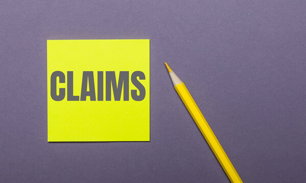 On a gray background, a bright yellow pencil and a yellow sticker with the word CLAIMS