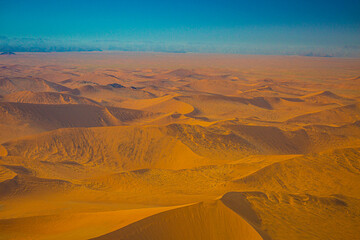 Fototapeta na wymiar Sand dunes of Namib Naukluft National Park from hot-air balloon early in the morning, Namibia.