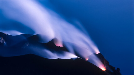 Stromboli gleaming and smoking over the ocean © Roland