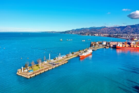Aerial view of the port and mountains in the background of Batumi, Georgia