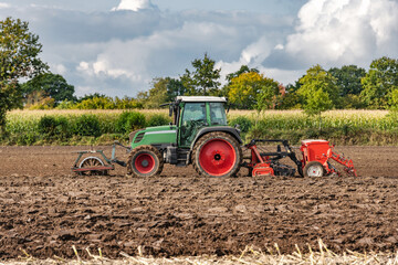 Tractor with power harrow and seed drill in the field | 4190