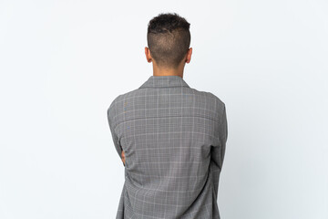 Young brazilian man isolated on white background in back position