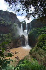 Gigantic Ouzoud Waterfalls in the Grand Atlas in Morocco with blue sky and sun