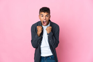 Young Brazilian man isolated on pink background frustrated by a bad situation