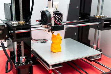 Modern 3D printer printing resin figure. Three-dimensional technology