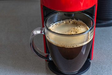 Coffee cup in coffee machine.